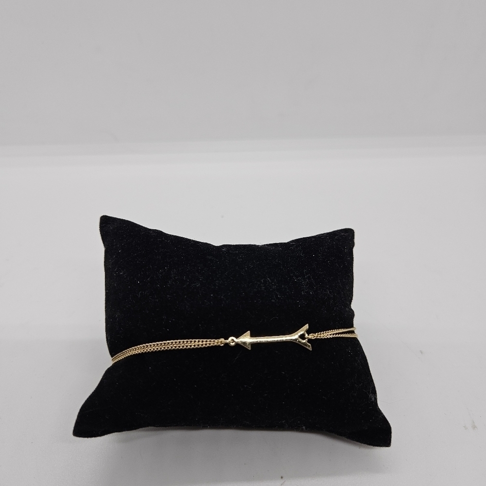 Stella & Dot gold tone and yellow drawstring bracelet with arrow charm